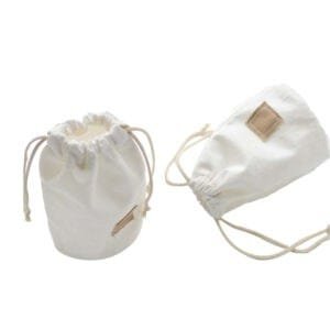 2 white small drawstring bags with square patch in the middle