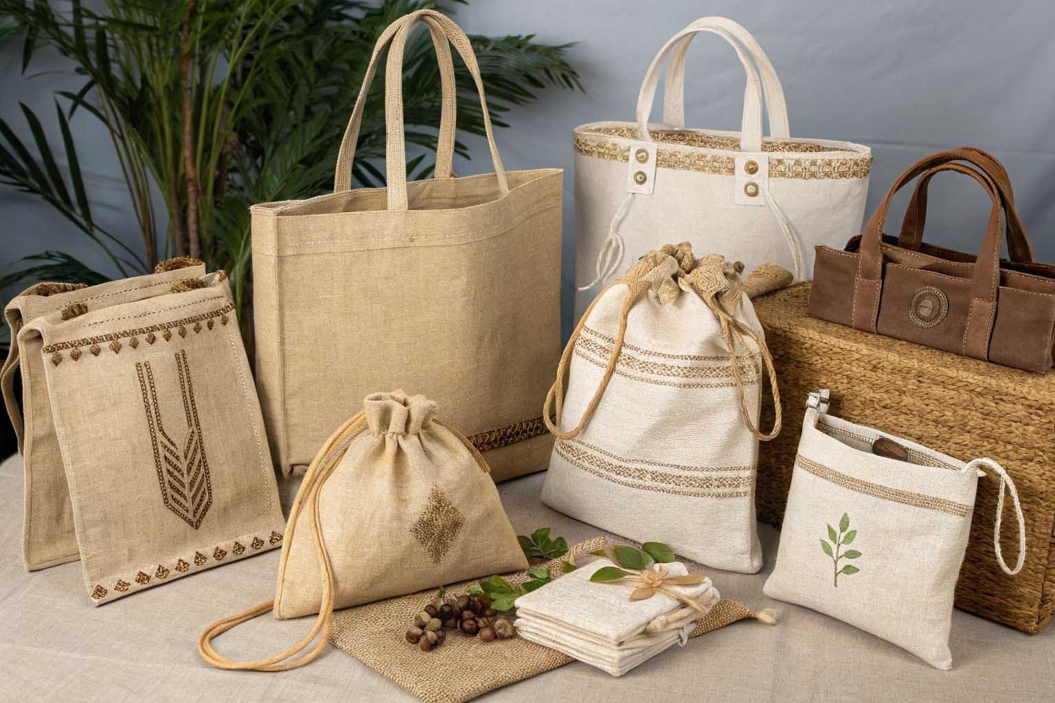 Assorted natural jute shopping bags with various designs and handles