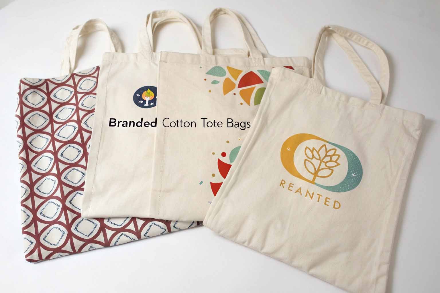 A collection of branded cotton tote bags showcasing customization options