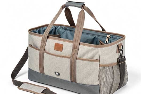 A pet tote bag showing multiple interior and exterior pockets