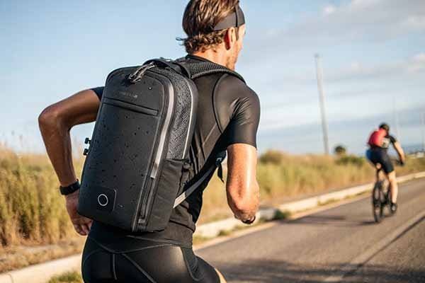 Person wearing a sleek neoprene sports backpack