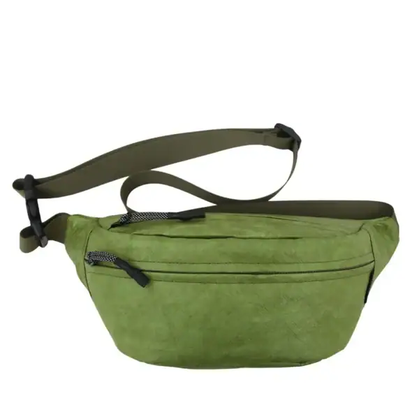 A green waist bag with black zippers and an adjustable strap