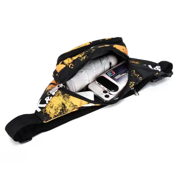 A black and yellow waist bag with an open zipper containing a mobile phone, an umbrella, and a card inside.