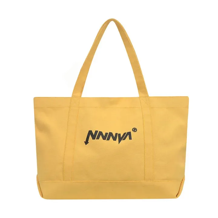 Yellow tote bag with 'NNNVA' logo