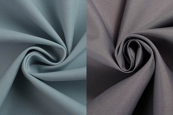 Two pieces of polyester fabric in different thicknesses, one in light blue and the other in gray, both with a smooth, swirled texture.
