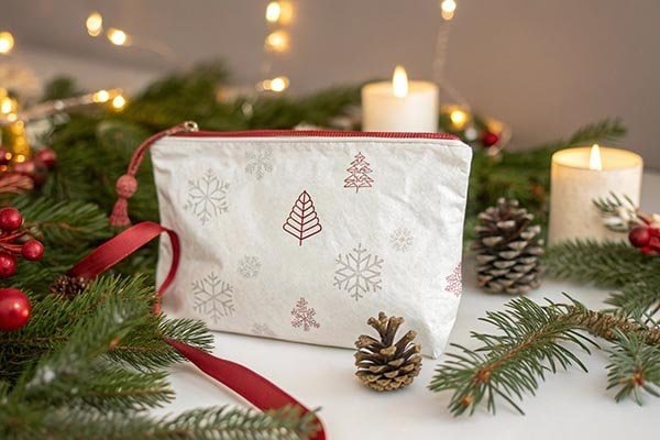 Tyvek pouch with a simple brand logo used to hold travel essentials