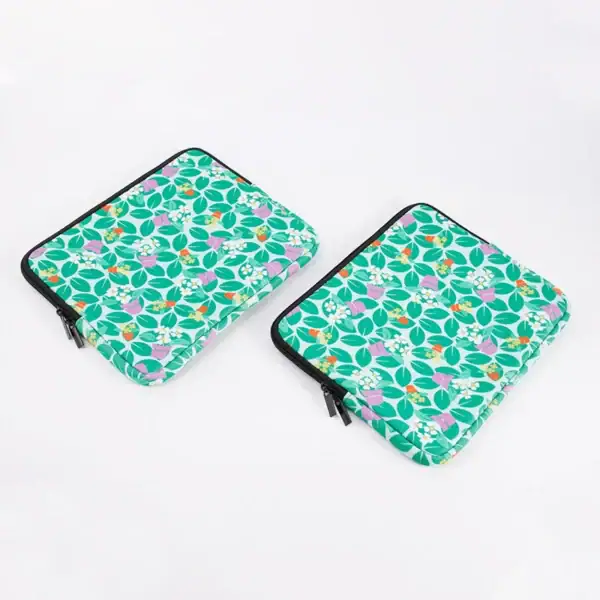 Colorful laptop sleeves featuring floral patterns, perfect for protecting devices.