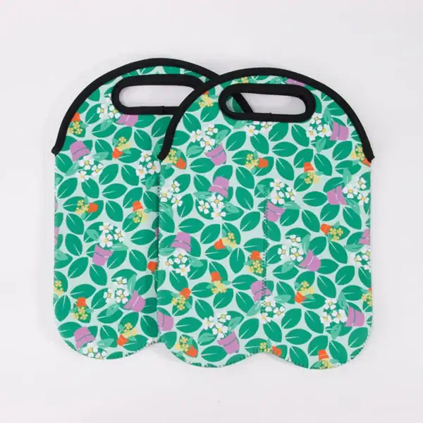 Two reusable shopping bags with a floral design and handles, featuring green leaves and colorful flowers on a mint background.