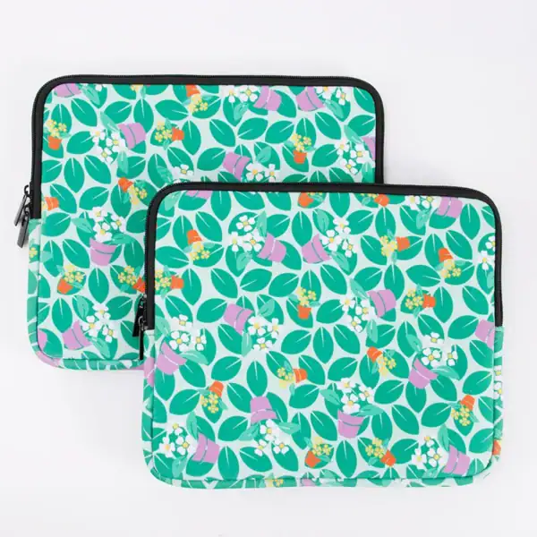 Floral design laptop sleeves with vibrant colors and patterns on display.