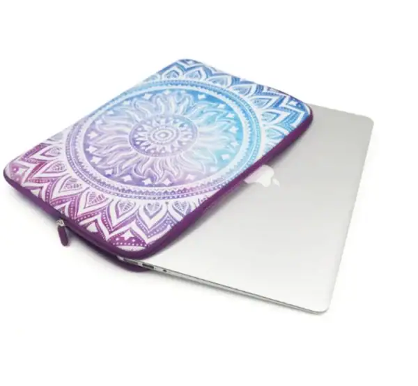 Colorful laptop sleeve with a sun and mandala design protecting a silver laptop.