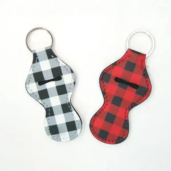 A pair of plaid keychain holders in black and red designs, ideal for stylish organization.