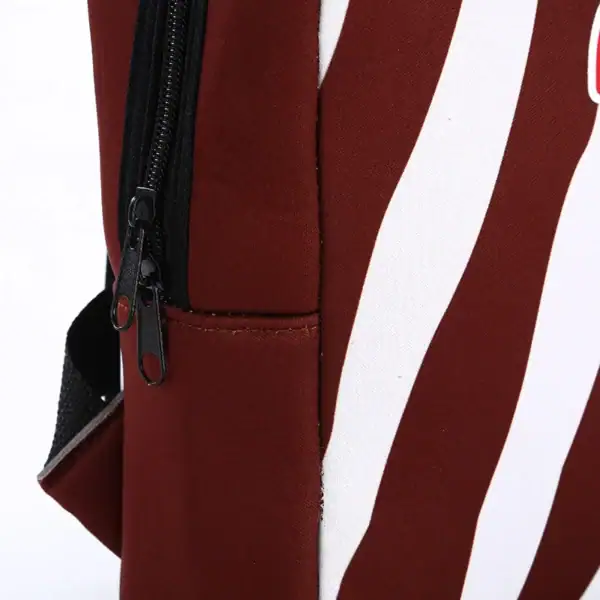 Close-up detail of a stylish reusable bag showing zipper and fabric texture.