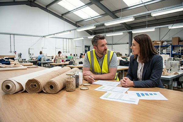 Factory manager talking to buyer