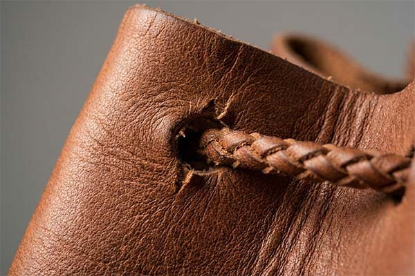 Close-up of stress points on a leather bag
