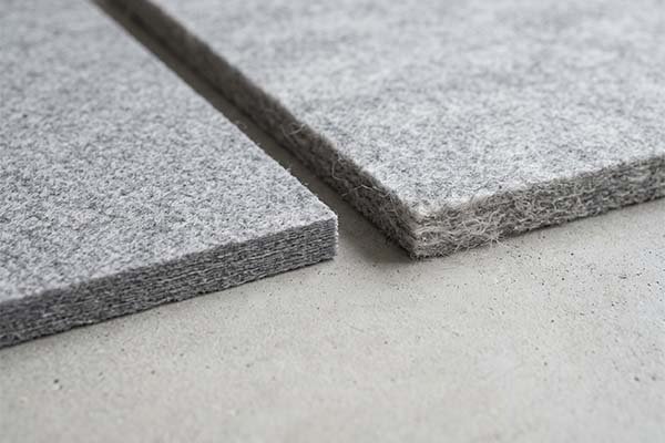 Macro shot comparing 3mm felt samples, highlighting the edge fiber structure and texture.