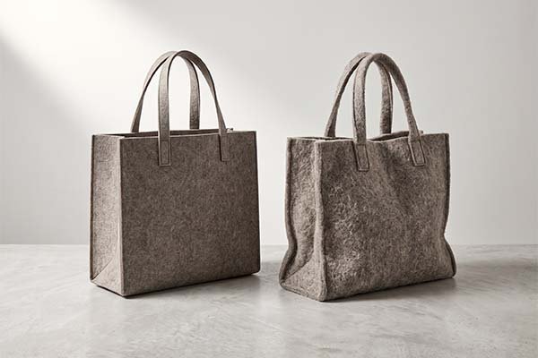 Felt bag durability test comparing a stiff, high-density bag with a soft, low-density bag.