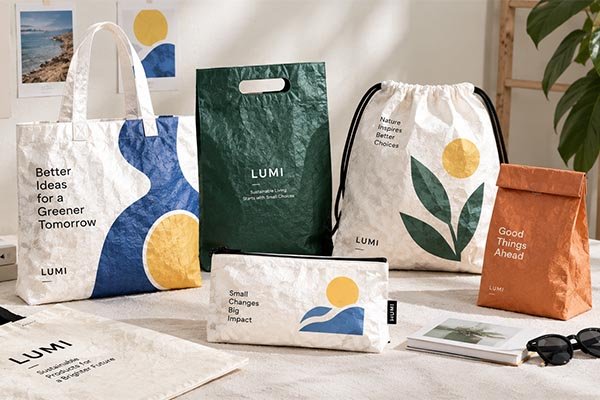 Creative Tyvek branding showcased on a variety of bags featuring colorful abstract prints and prominent logo placement.