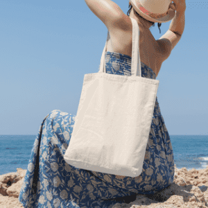 tote-bag-mockup-featuring-a-woman-facing-backward-at-the-beach-15-el_large